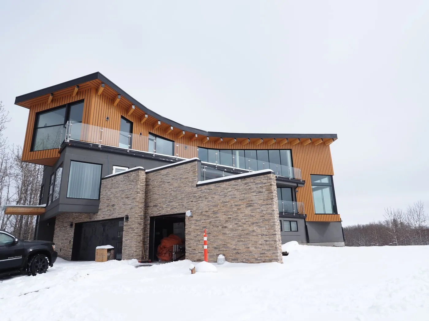 Completed Bearspaw home — rear view in winter