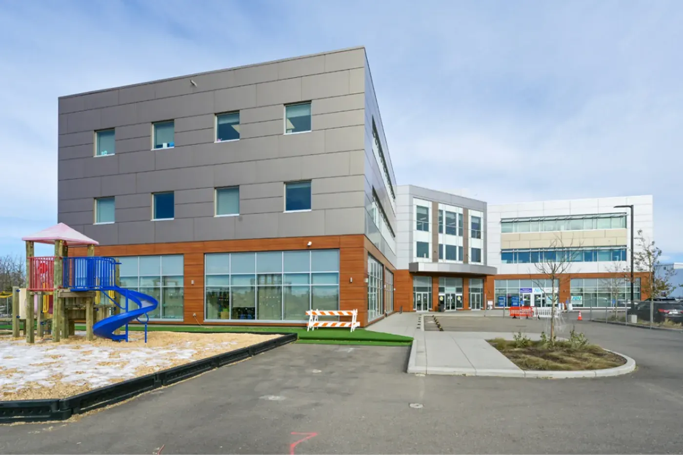 Completed commercial building exterior with playground