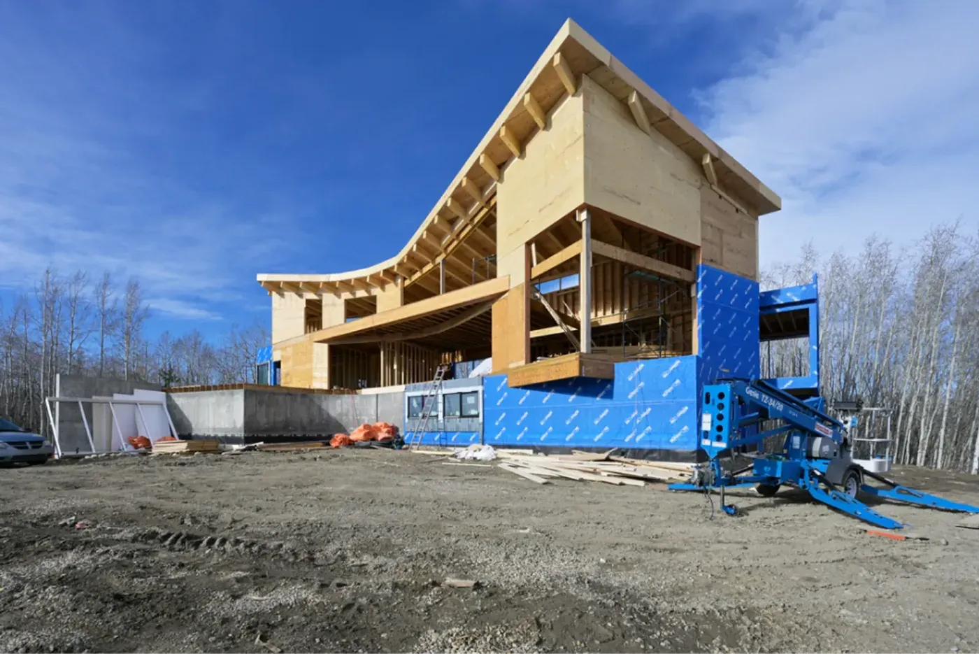 Curved roofline timber framing on construction site