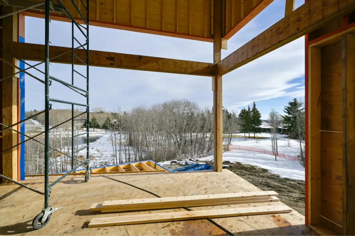 Home framing interior open wall scaffolding winter landscape